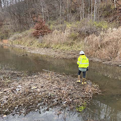 EnviroTrac technician stream surveying and surface water sampling.